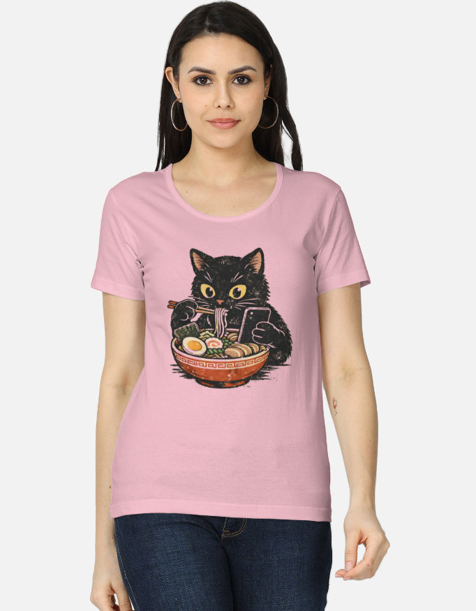 Woman wearing a light baby pink t-shirt with a cat graphic design