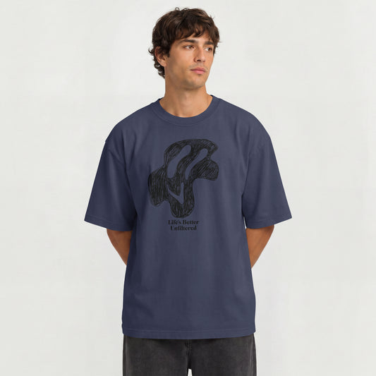 Navy Blue Young man in oversized streetwear T-shirt with "Life's Better Unfiltered" trippy graphic print.