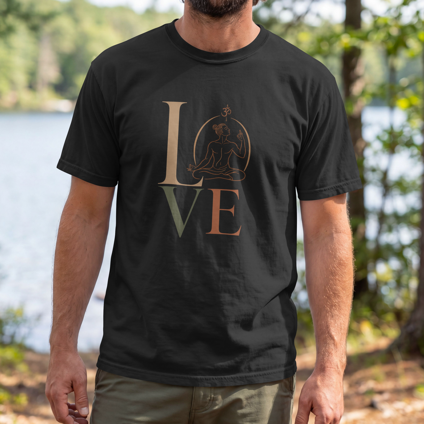 A man modelling a black graphic t-shirt featuring a minimalist "LOVE" design with a meditating yoga pose and an Om symbol