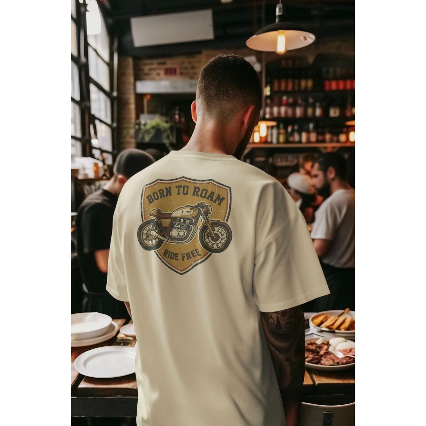 Male model wearing the Nauma Born To Roam cafe racer oversized t-shirt in Off White, boxy unisex fit