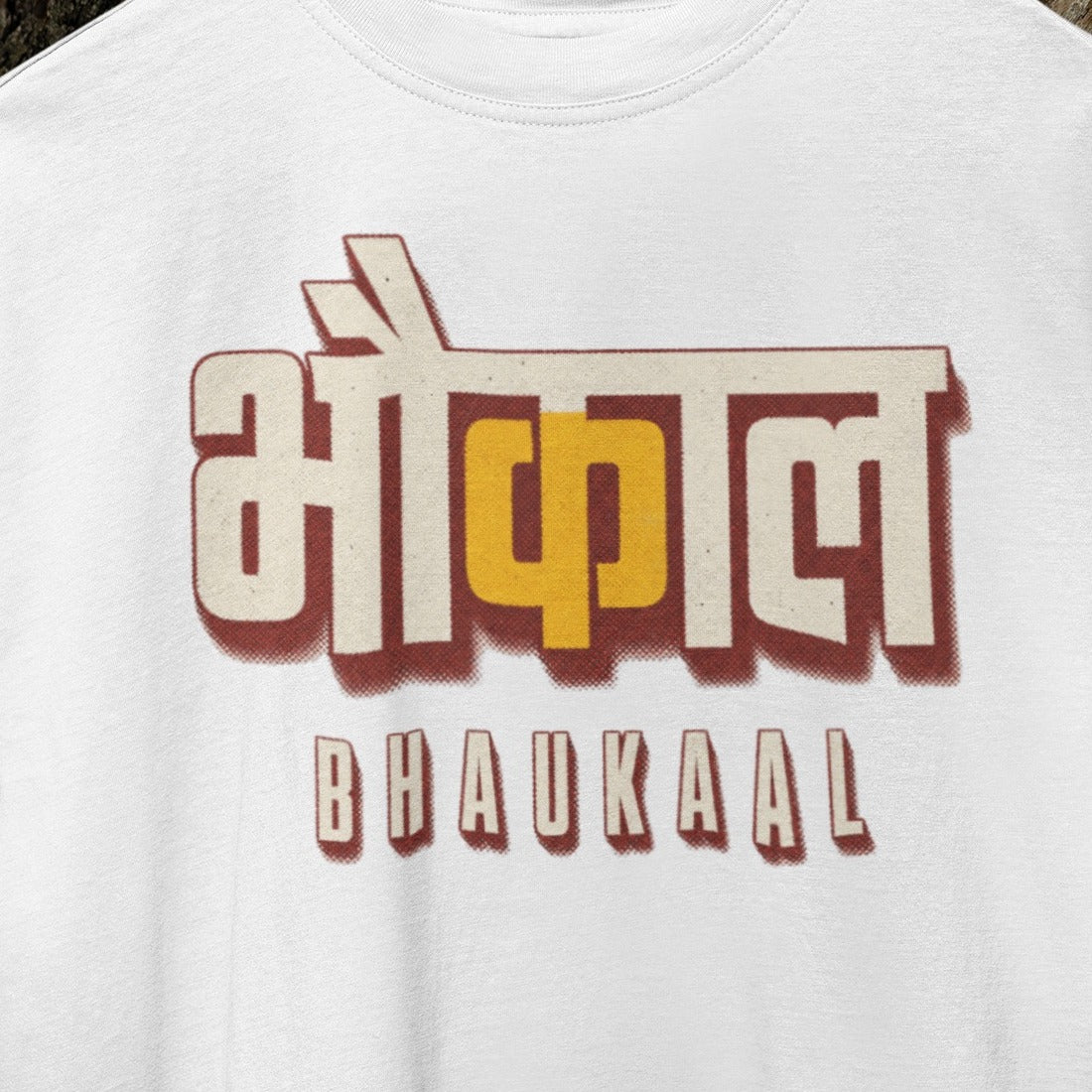 White Bhaukaal oversized t-shirt, close-up of the cream and mustard 3D Hindi typography print
