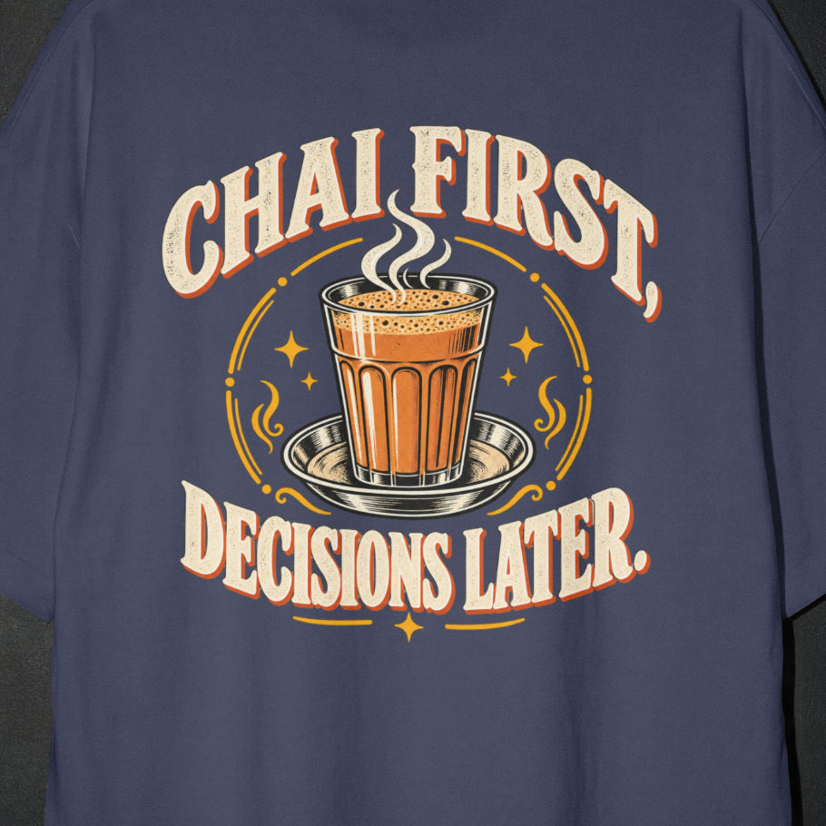Navy Blue Chai First Decisions Later T-shirt print close-up: cream retro lettering around a steaming cutting chai glass on a steel saucer