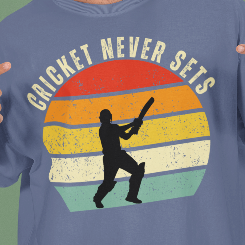 Steel Grey Cricket Never Sets t-shirt close-up of the distressed vintage sunset print with batsman silhouette