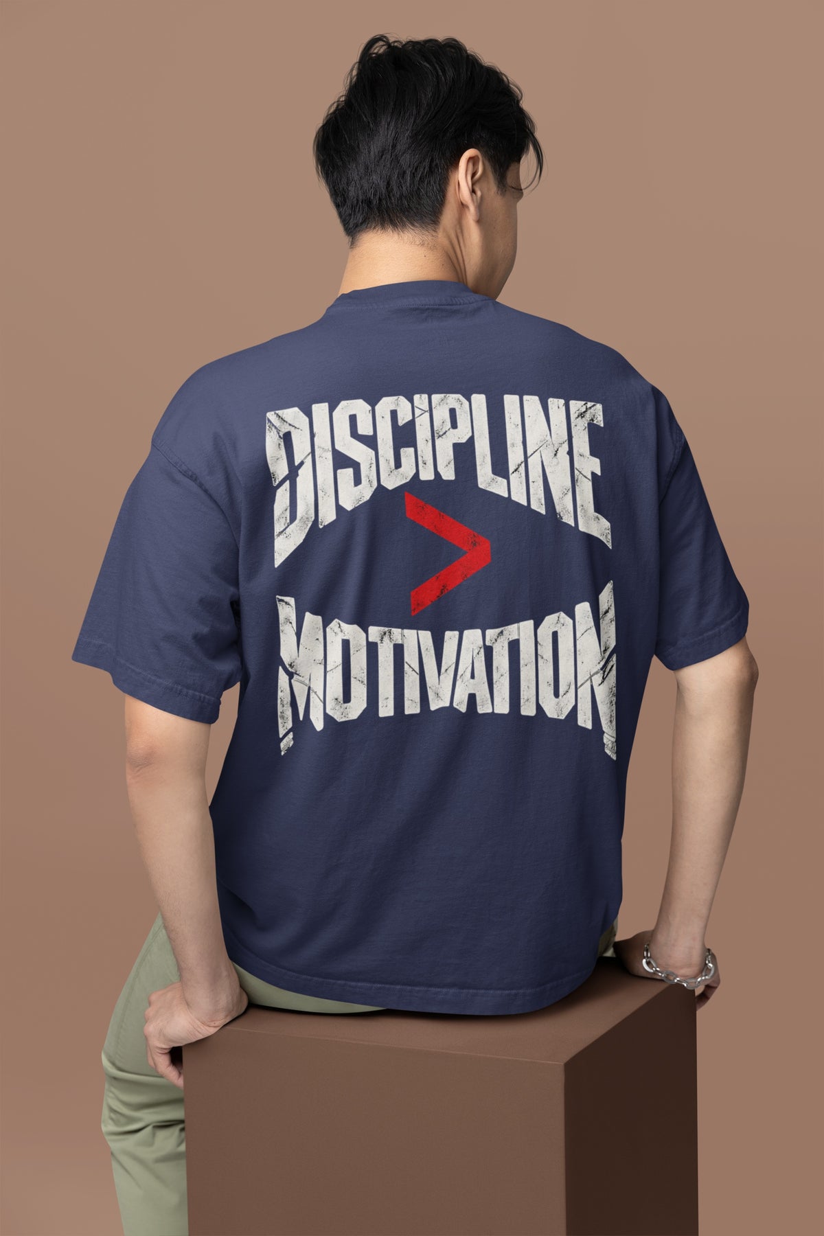 Navy Blue Discipline Over Motivation back print unisex oversized t-shirt worn by a man, back view