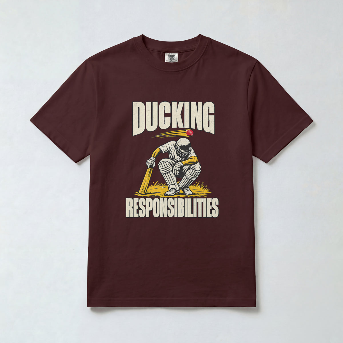 Maroon Ducking Responsibilities cricket t-shirt, front view with crouching batsman graphic