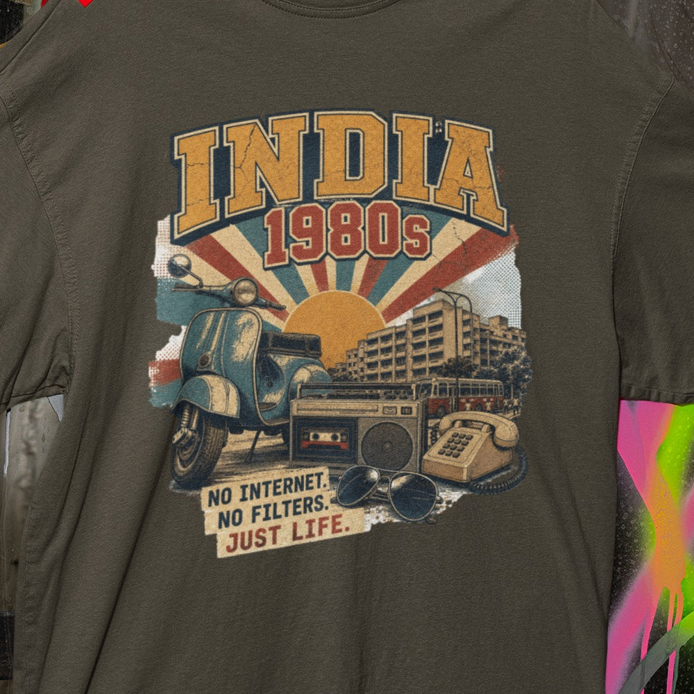 Close-up of the INDIA 1980s print on the Olive Green oversized t-shirt – retro sunset rays, scooter, sunglasses and No Internet No Filters Just Life slogan