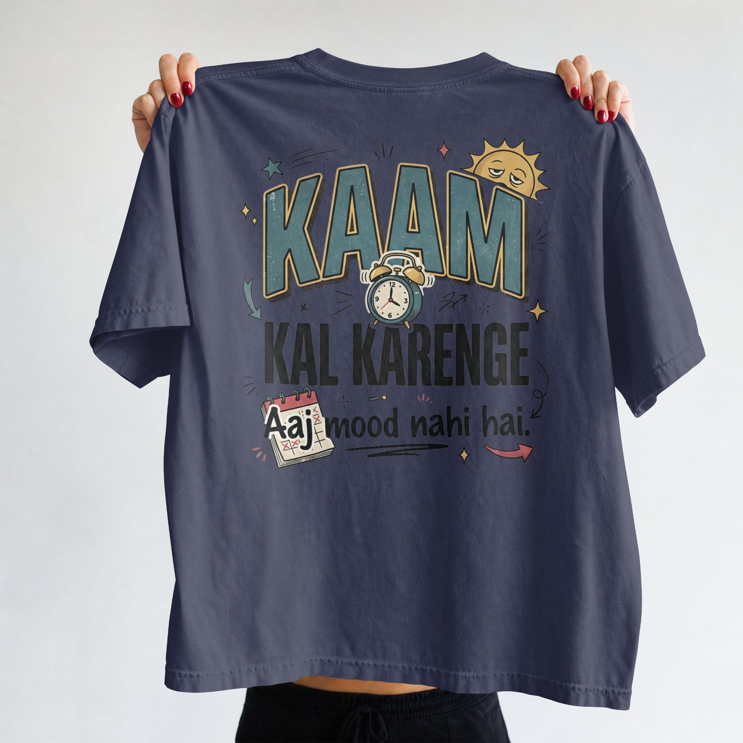Navy blue Nauma oversized t-shirt, front view, with bold 'Kaam Kal Karenge' typography and doodle graphic.
