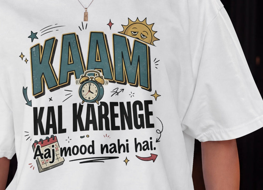 White Nauma oversized t-shirt design close-up of 'Kaam Kal Karenge' bold typography and doodle art.