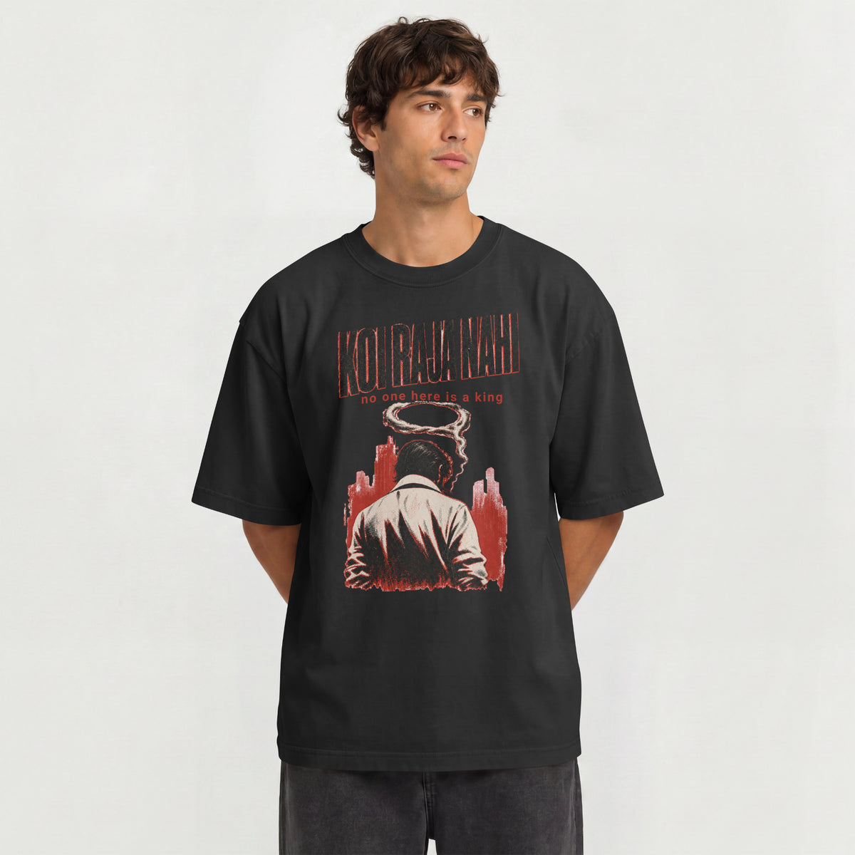 Man wearing the black Koi Raja Nahi Hinglish oversized t-shirt with drop shoulder fit