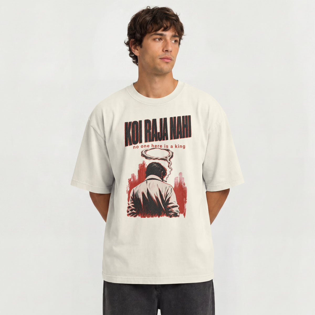 Man wearing the off white Koi Raja Nahi oversized t-shirt with black distressed typography