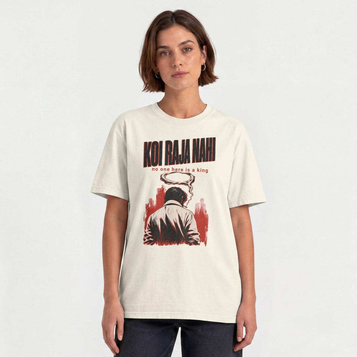 Woman wearing the off white Koi Raja Nahi unisex oversized Hinglish graphic tee
