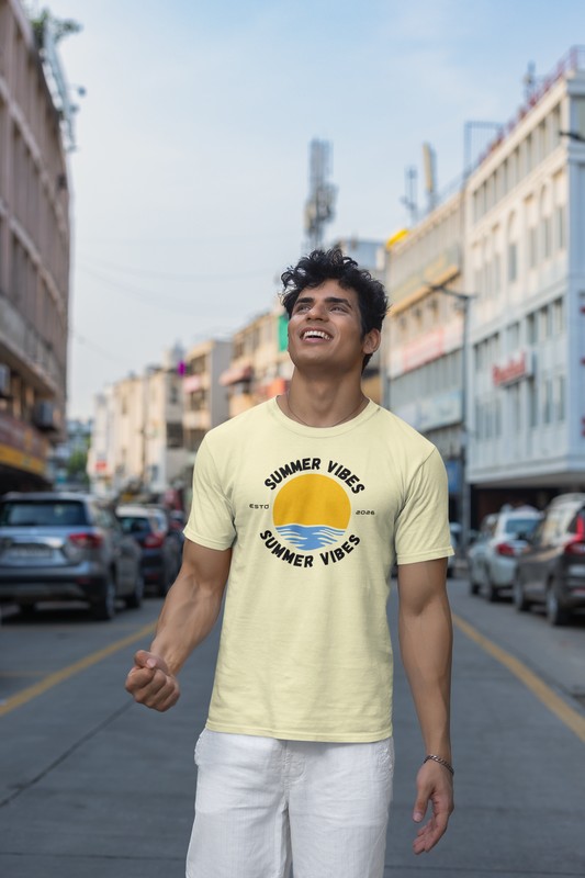 Man wearing a almond 'Summer Vibes' t-shirt on a city street
