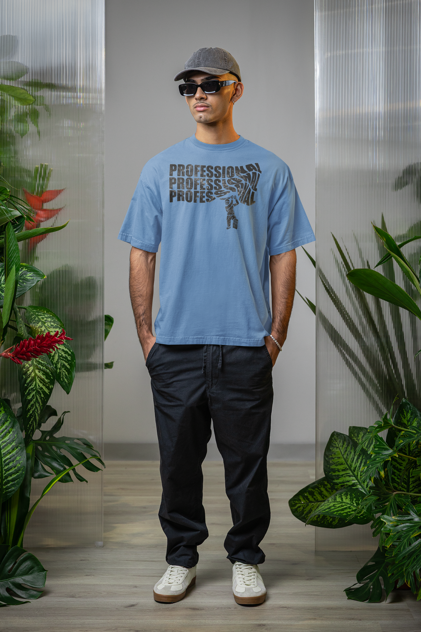 Man wearing a baby blue t-shirt with text professional cricket