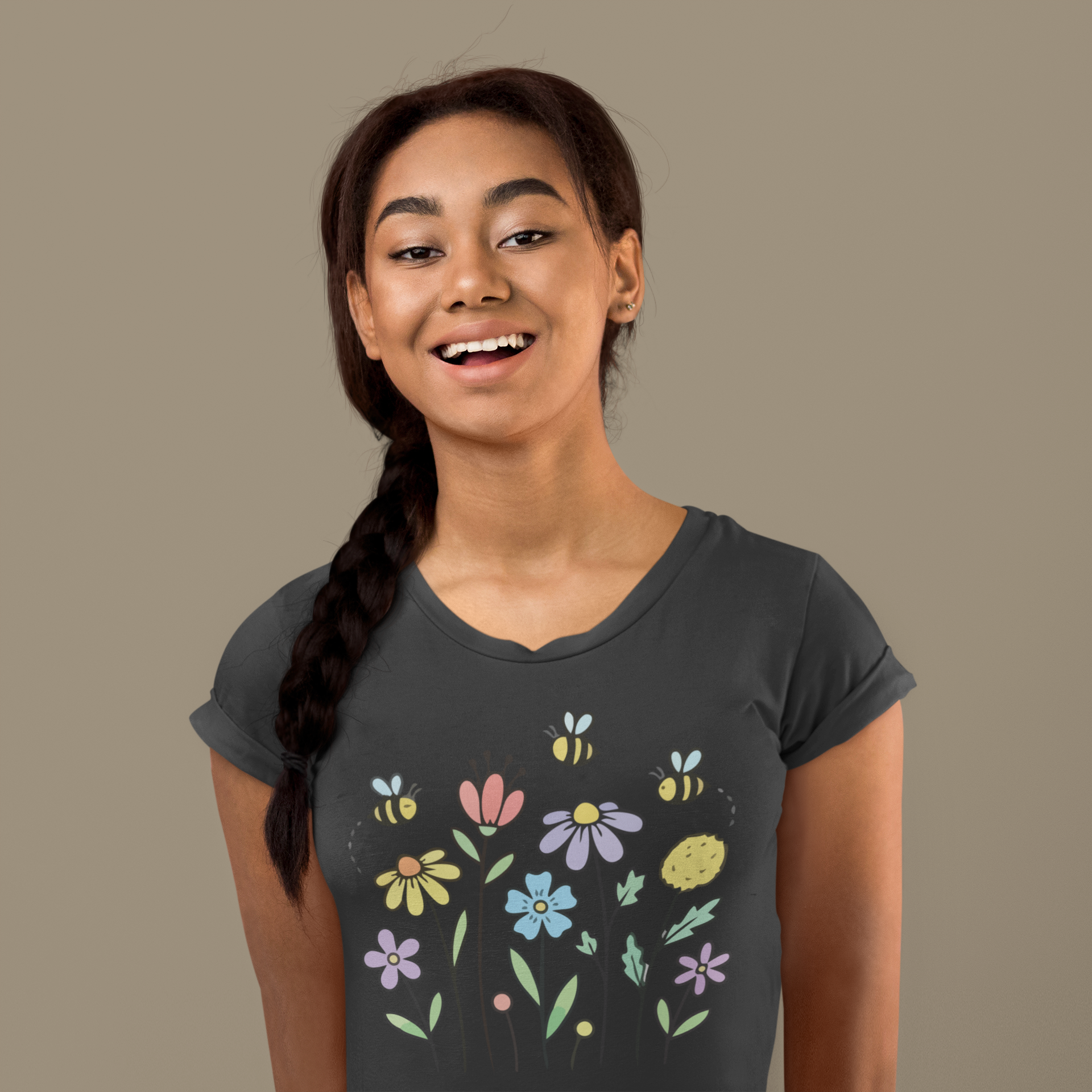 Young woman wearing a black t-shirt with colorful floral designs.