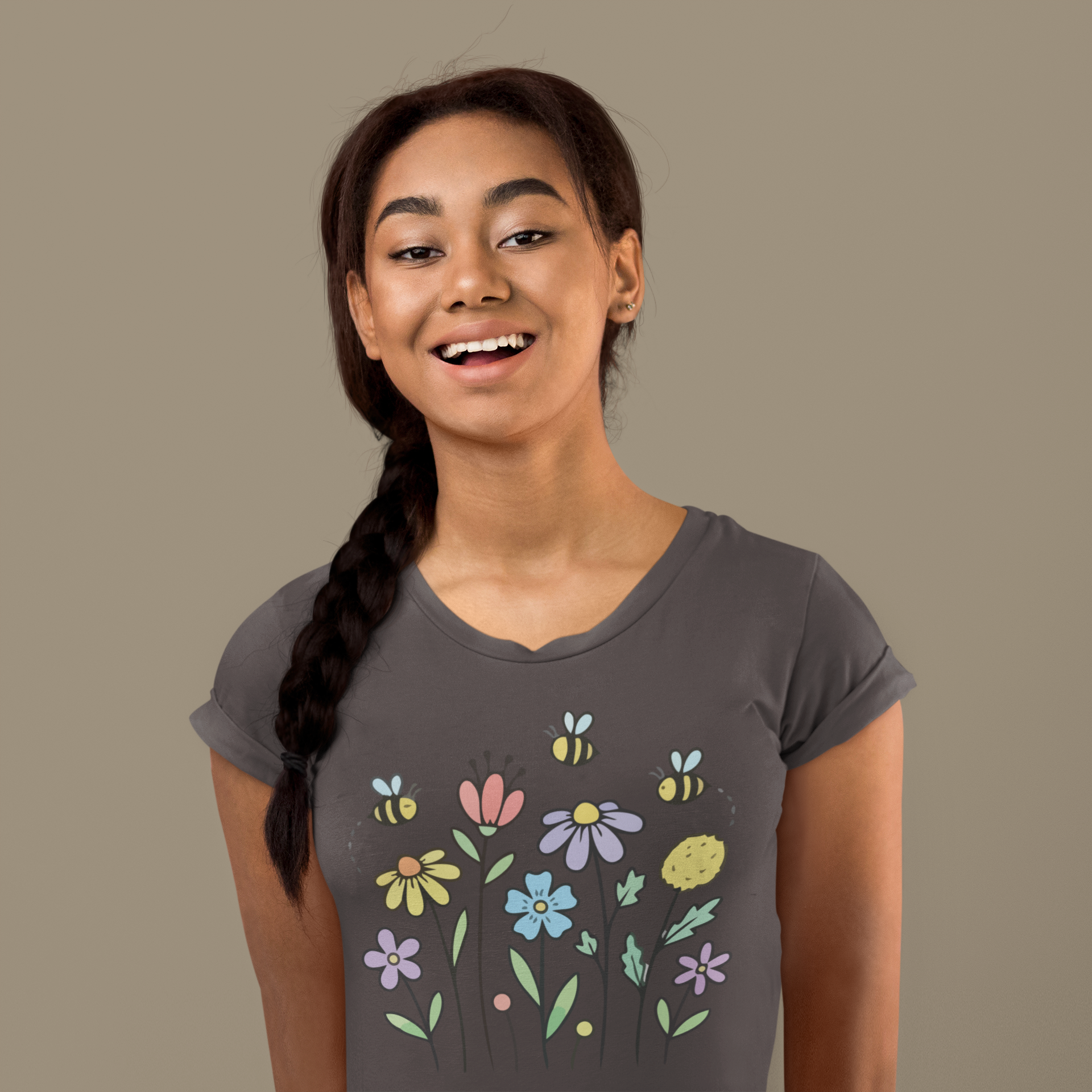 Young woman wearing a charcoal grey t-shirt with colorful floral designs.