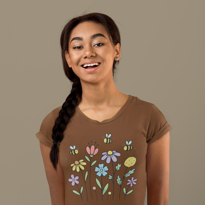 Young woman wearing a coffee brown t-shirt with colorful floral designs.