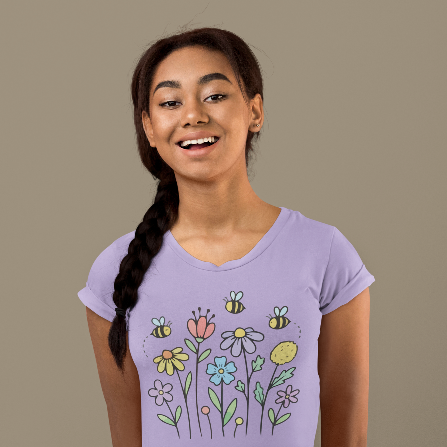 Young woman wearing a lavender t-shirt with colorful floral designs.