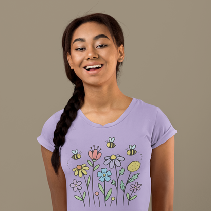 Young woman wearing a lavender t-shirt with colorful floral designs.