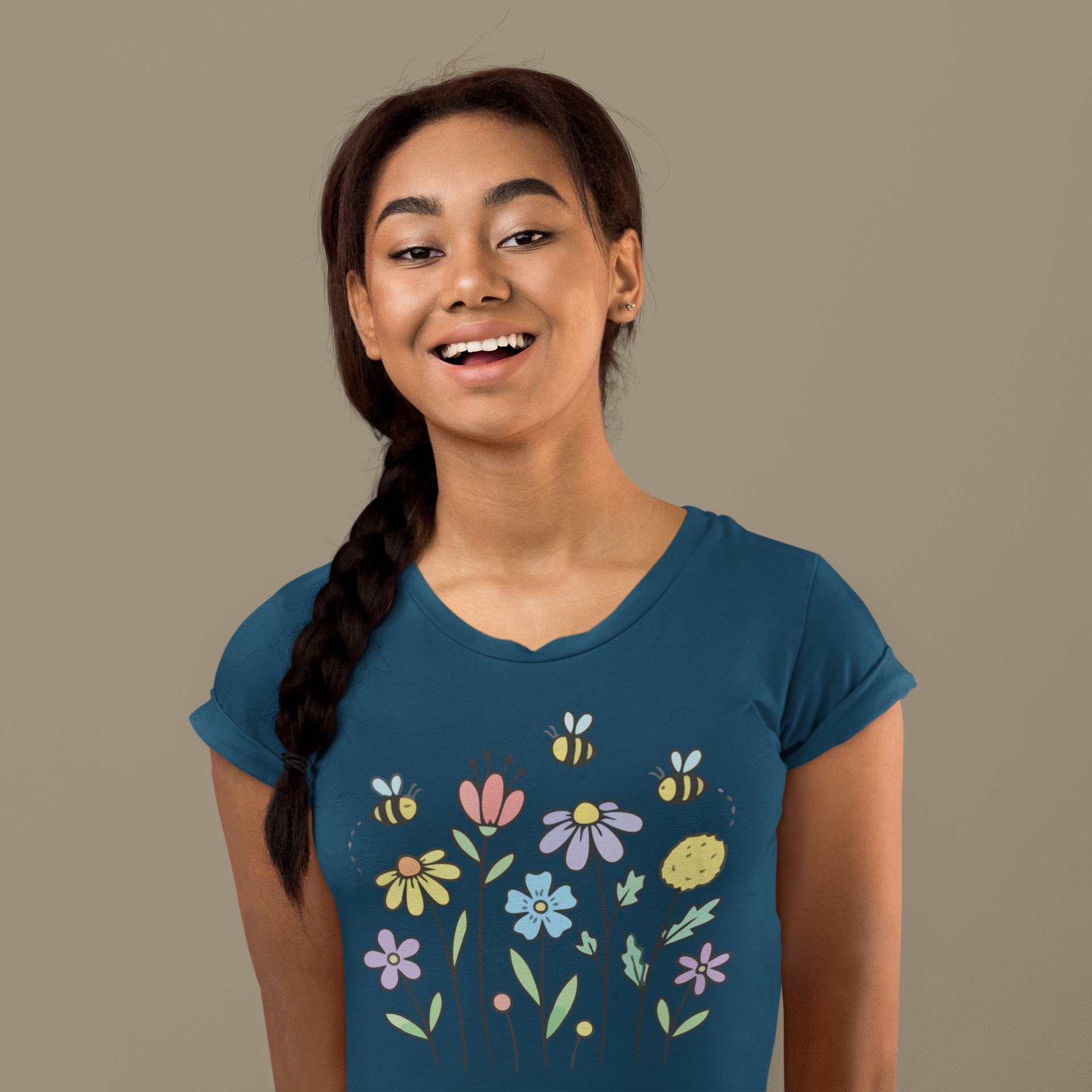 Young woman wearing a navy blue t-shirt with colorful floral designs.