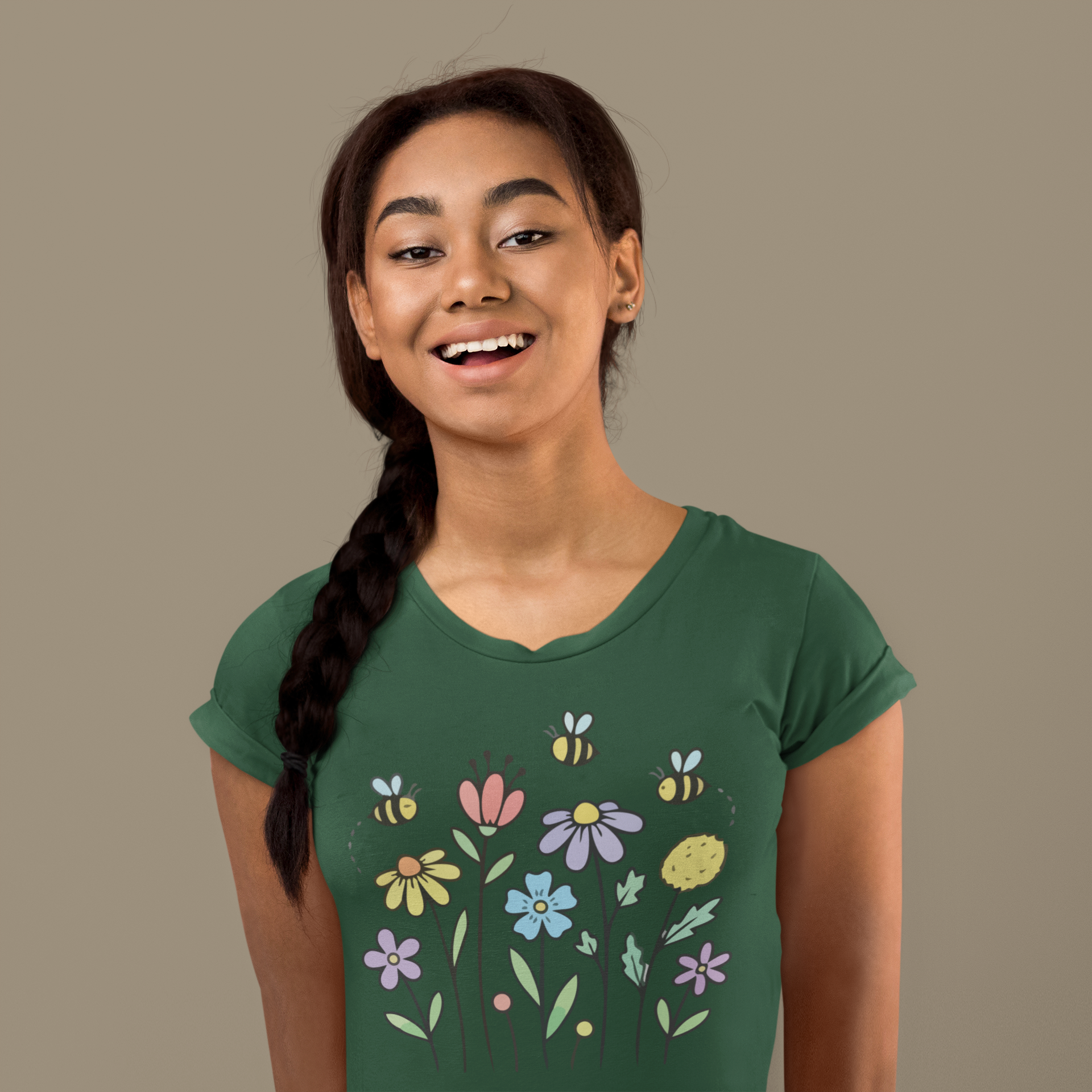 Young woman wearing a olive green t-shirt with colorful floral designs.