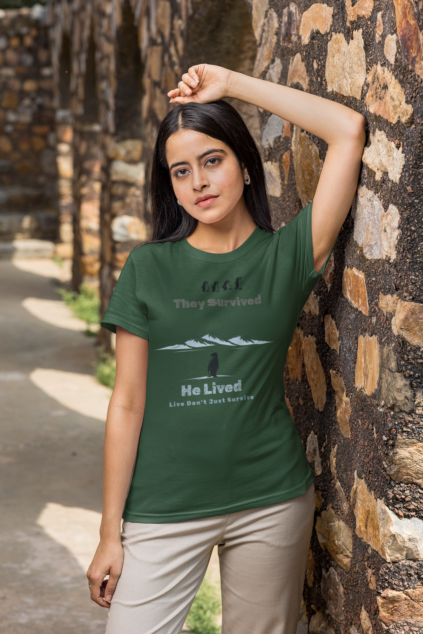 Bottle Green Minimalist penguin design with inspirational quote “They survived. He lived.” t-shirt style graphic.