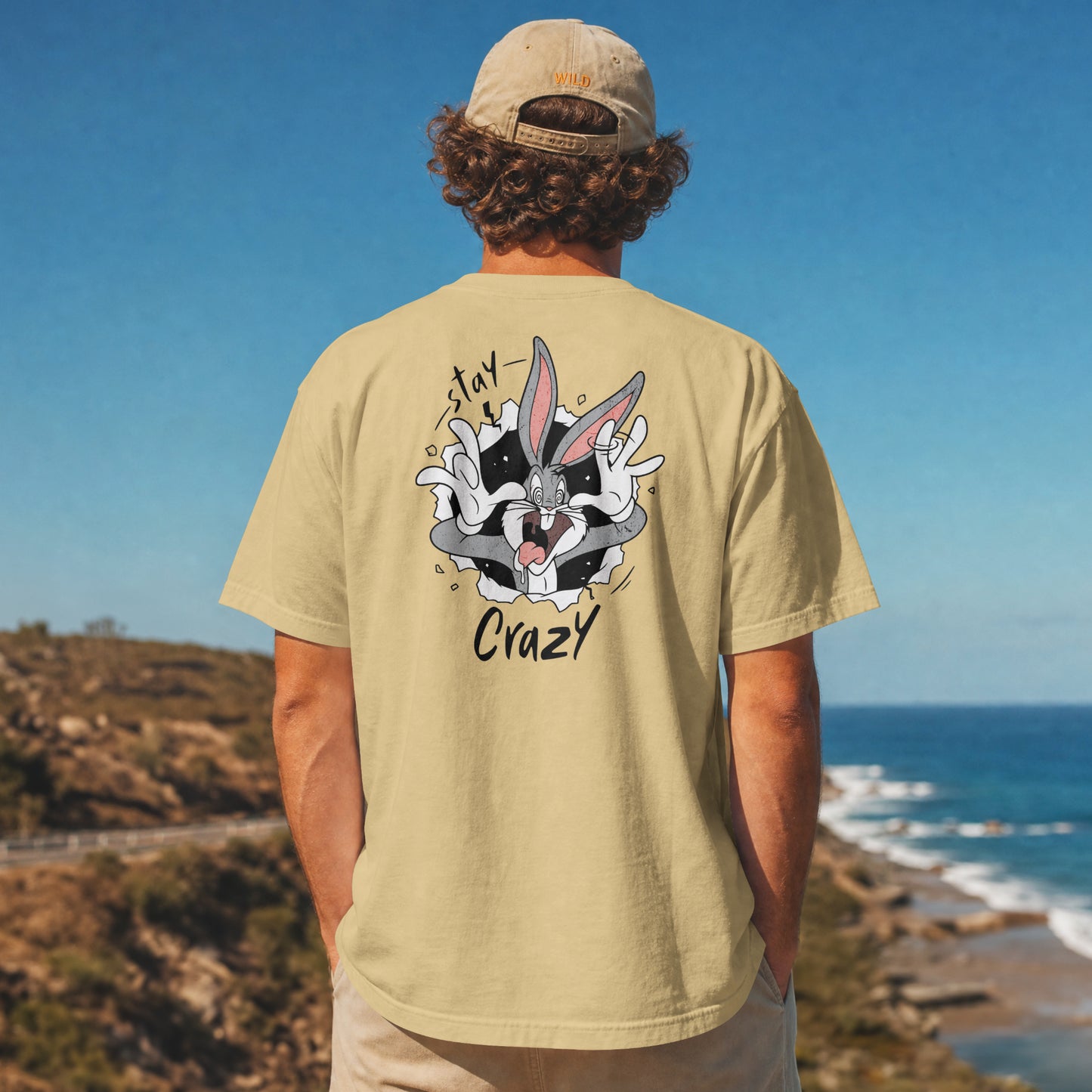 Beige oversized unisex t-shirt with a Stay Crazy Bugs Bunny graphic breaking through the fabric, back view