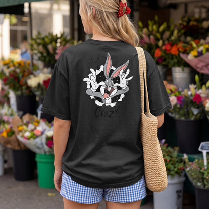 Black oversized unisex t-shirt with a Stay Crazy Bugs Bunny graphic breaking through the fabric, back view