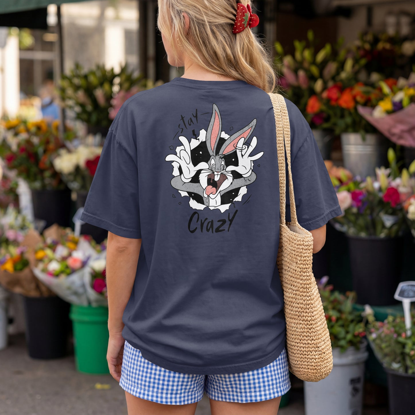 Navy Blue oversized unisex t-shirt with a Stay Crazy Bugs Bunny graphic breaking through the fabric, back view