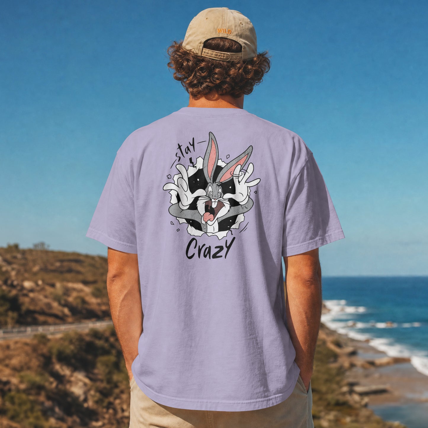 Lavender oversized unisex t-shirt with a Stay Crazy Bugs Bunny graphic breaking through the fabric, back view