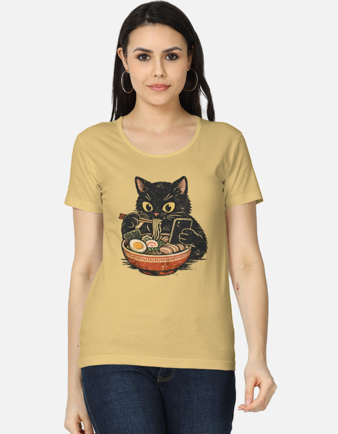 Woman wearing a beige t-shirt with a cat graphic design