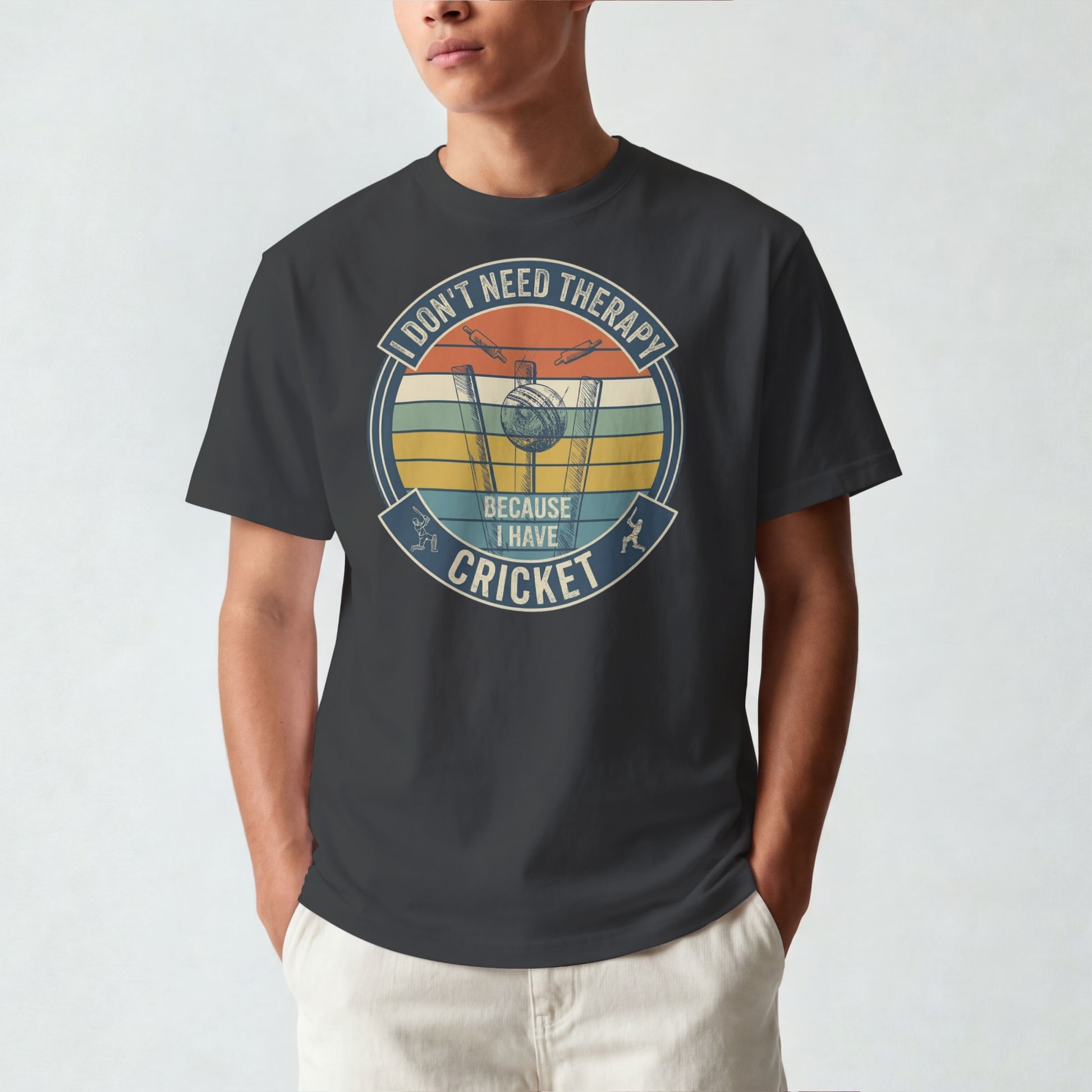 Black vintage cricket t-shirt featuring the slogan “I Don’t Need Therapy Because I Have Cricket” with retro sunset stripes, cricket stumps, bat, and ball graphic