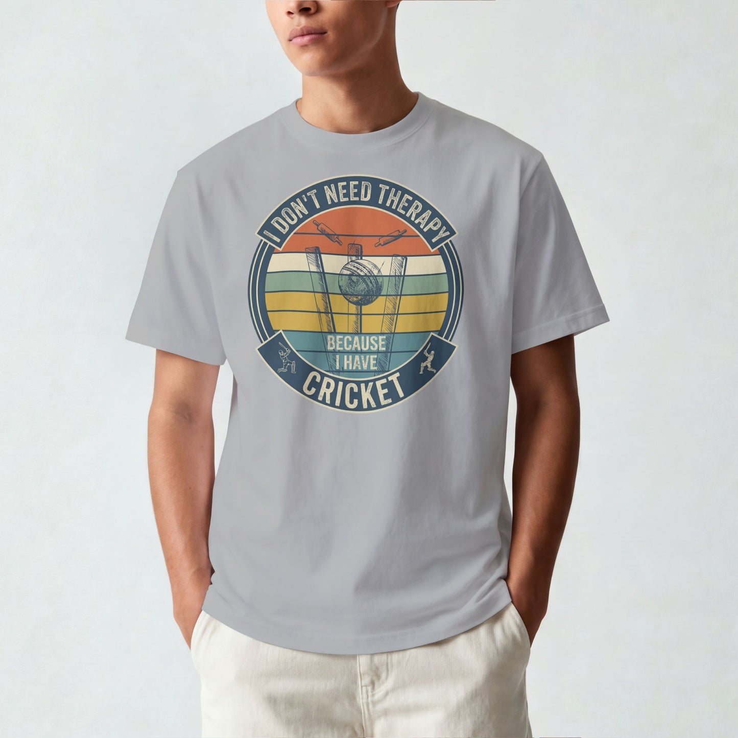 Melange Grey vintage cricket t-shirt featuring the slogan “I Don’t Need Therapy Because I Have Cricket” with retro sunset stripes, cricket stumps, bat, and ball graphic.