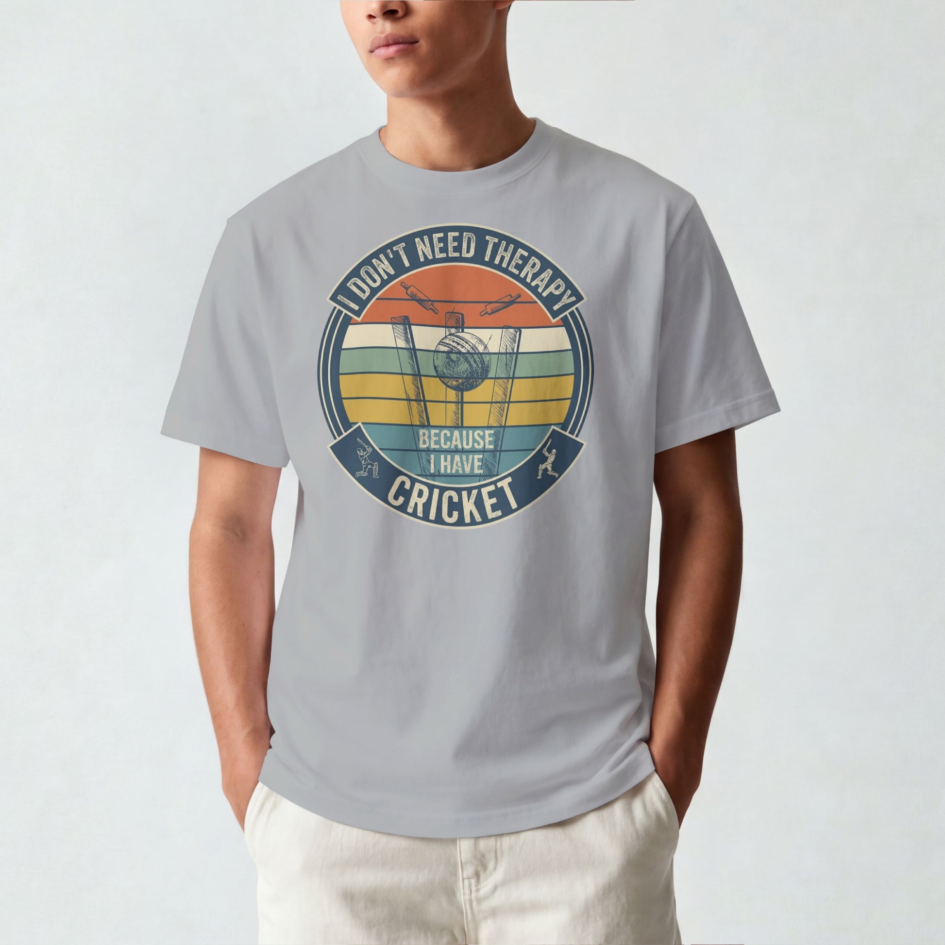 Melange Grey vintage cricket t-shirt featuring the slogan “I Don’t Need Therapy Because I Have Cricket” with retro sunset stripes, cricket stumps, bat, and ball graphic.