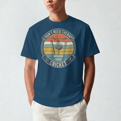 Navy Blue vintage cricket t-shirt featuring the slogan “I Don’t Need Therapy Because I Have Cricket” with retro sunset stripes, cricket stumps, bat, and ball graphic.