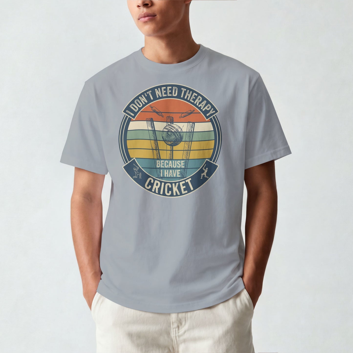 Silver Frost vintage cricket t-shirt featuring the slogan “I Don’t Need Therapy Because I Have Cricket” with retro sunset stripes, cricket stumps, bat, and ball graphic.