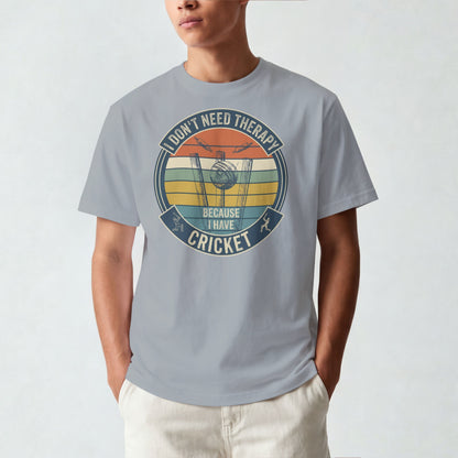 Silver Frost vintage cricket t-shirt featuring the slogan “I Don’t Need Therapy Because I Have Cricket” with retro sunset stripes, cricket stumps, bat, and ball graphic.