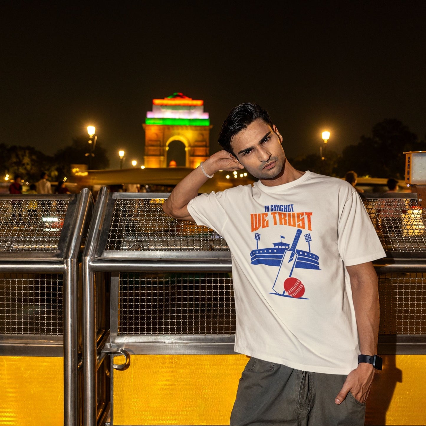 Off White In Cricket We Trust oversized t-shirt design with cricket bat, ball and stadium graphic