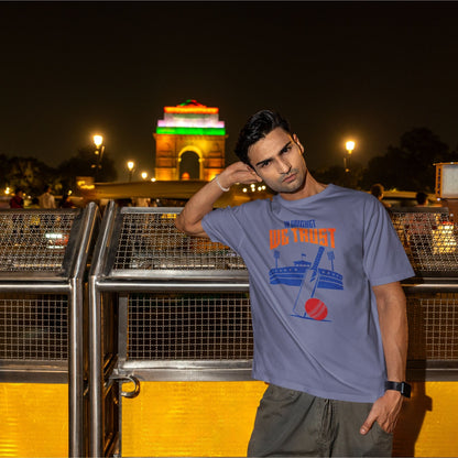 Steel Grey In Cricket We Trust oversized t-shirt design with cricket bat, ball and stadium graphic