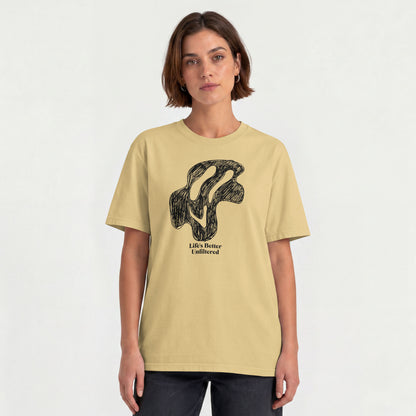 Beige Young woman wearing a relaxed fit cotton tee featuring a melting doodle design and "Life's Better Unfiltered"