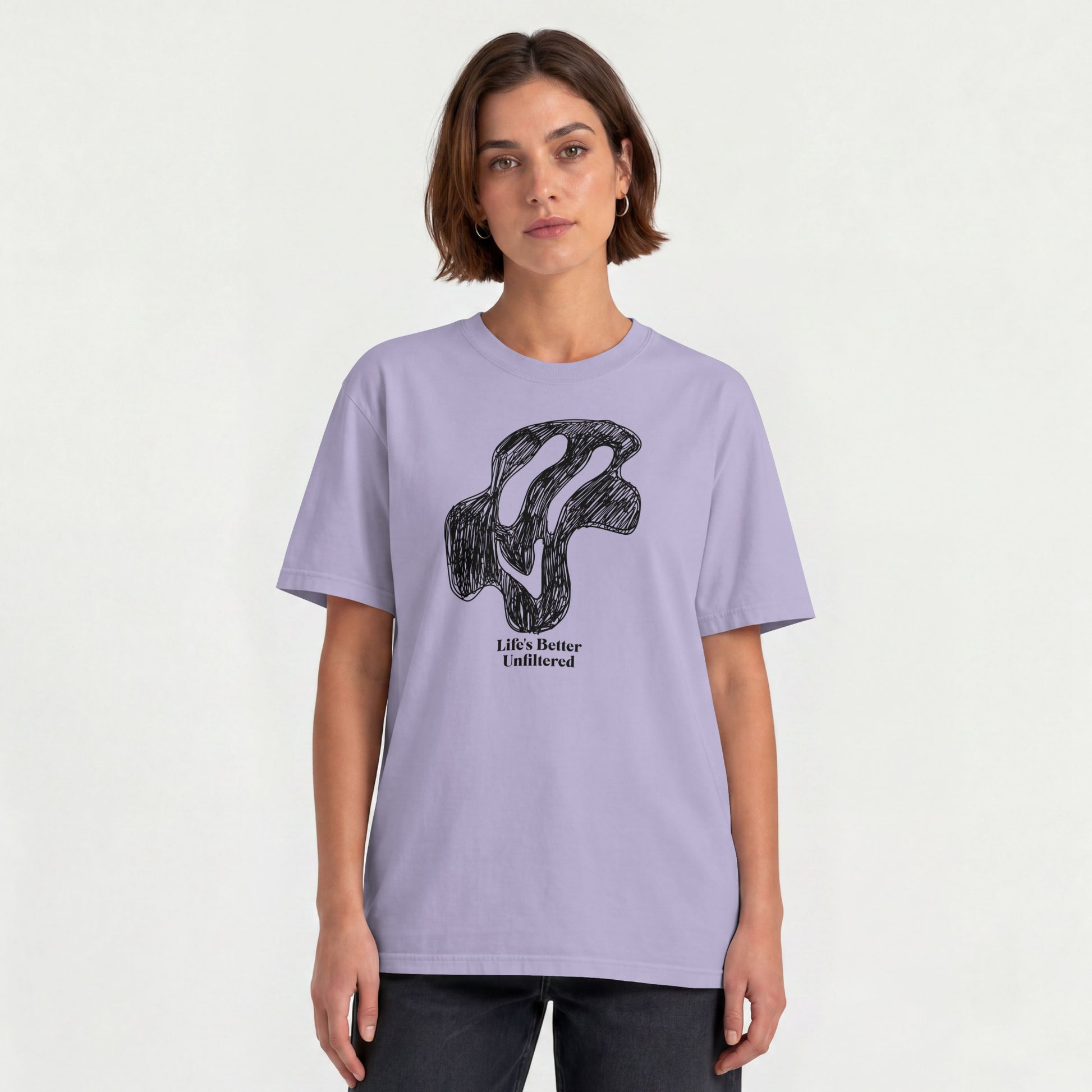 Lavender Young woman wearing a relaxed fit cotton tee featuring a melting doodle design and "Life's Better Unfiltered"