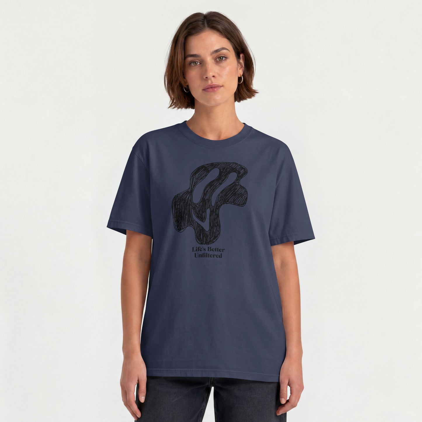 Navy Blue Young woman wearing a relaxed fit cotton tee featuring a melting doodle design and "Life's Better Unfiltered"