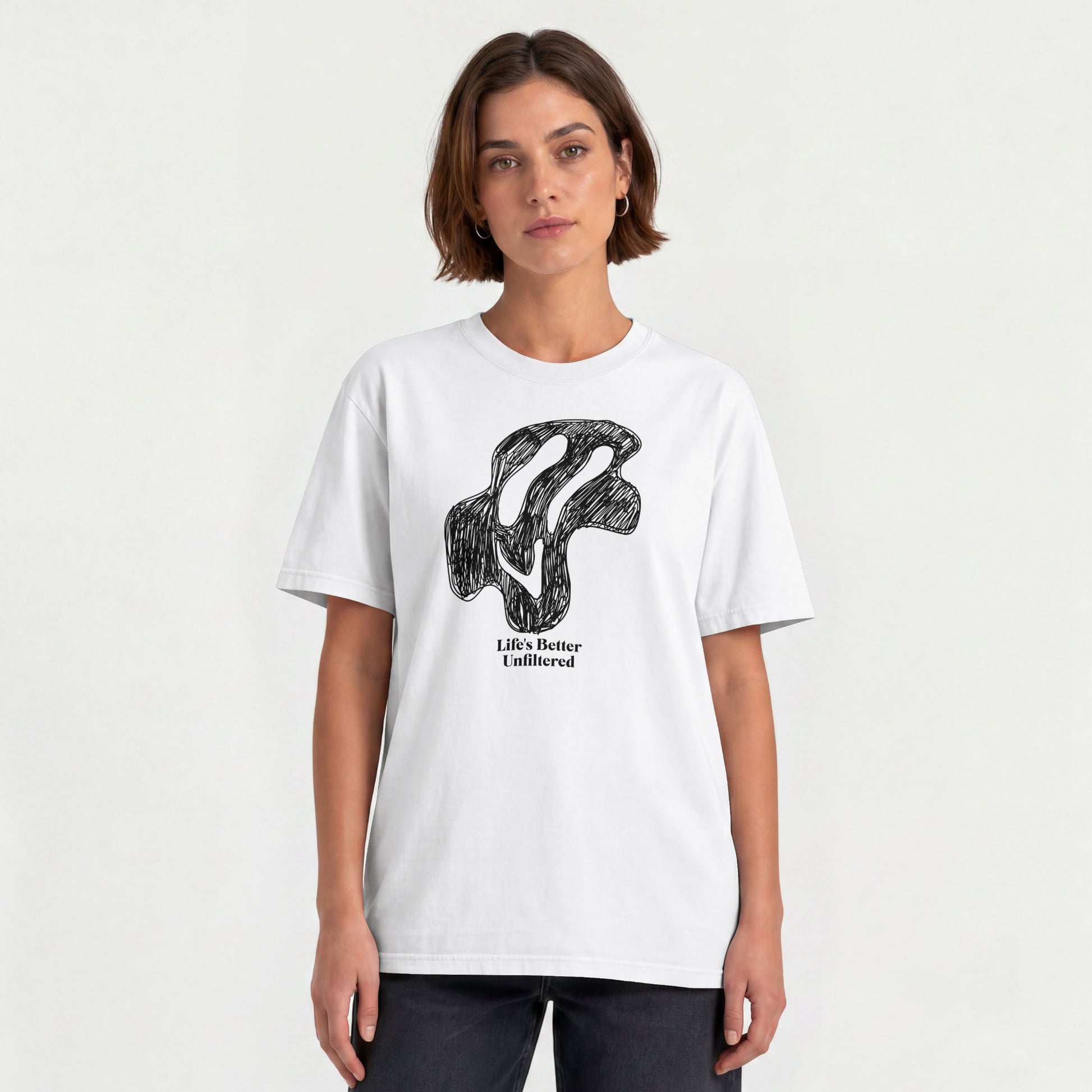 White Young woman wearing a relaxed fit cotton tee featuring a melting doodle design and "Life's Better Unfiltered"