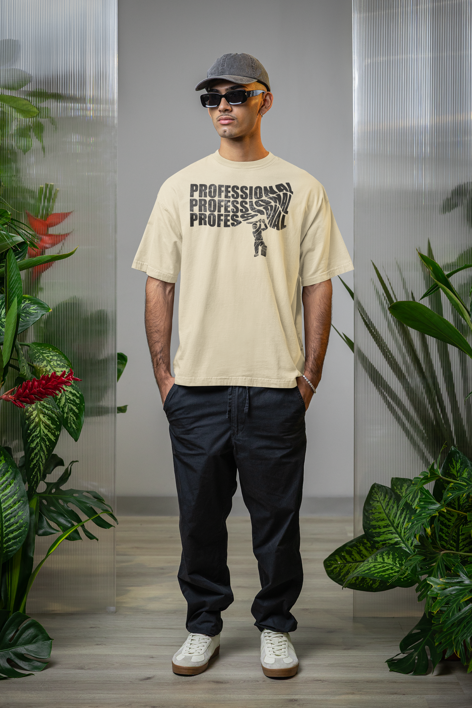 Man wearing a off white t-shirt with text professional cricket