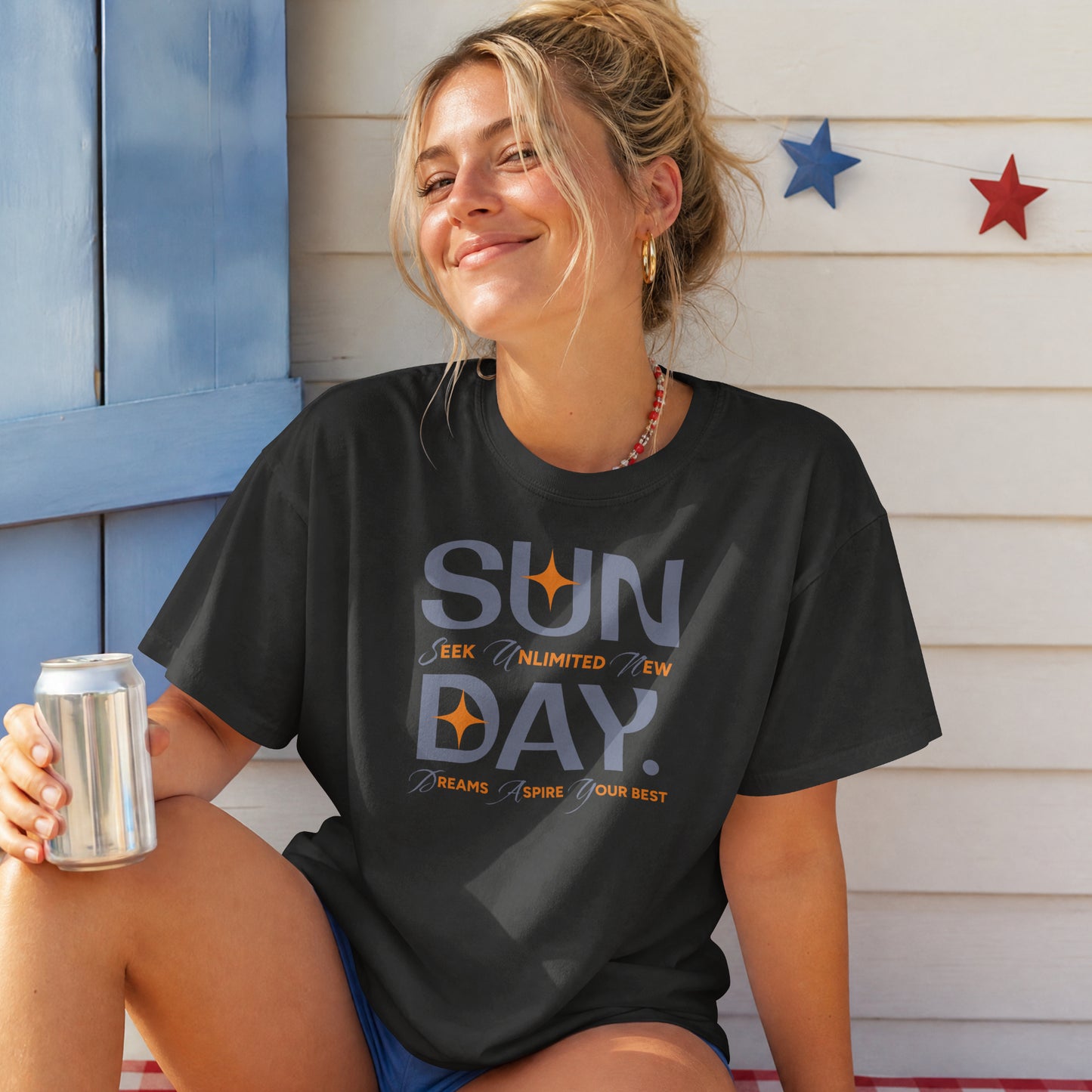Black unisex oversized t-shirt featuring 'Sunday Seek Unlimited New Day' graphic print, front view.