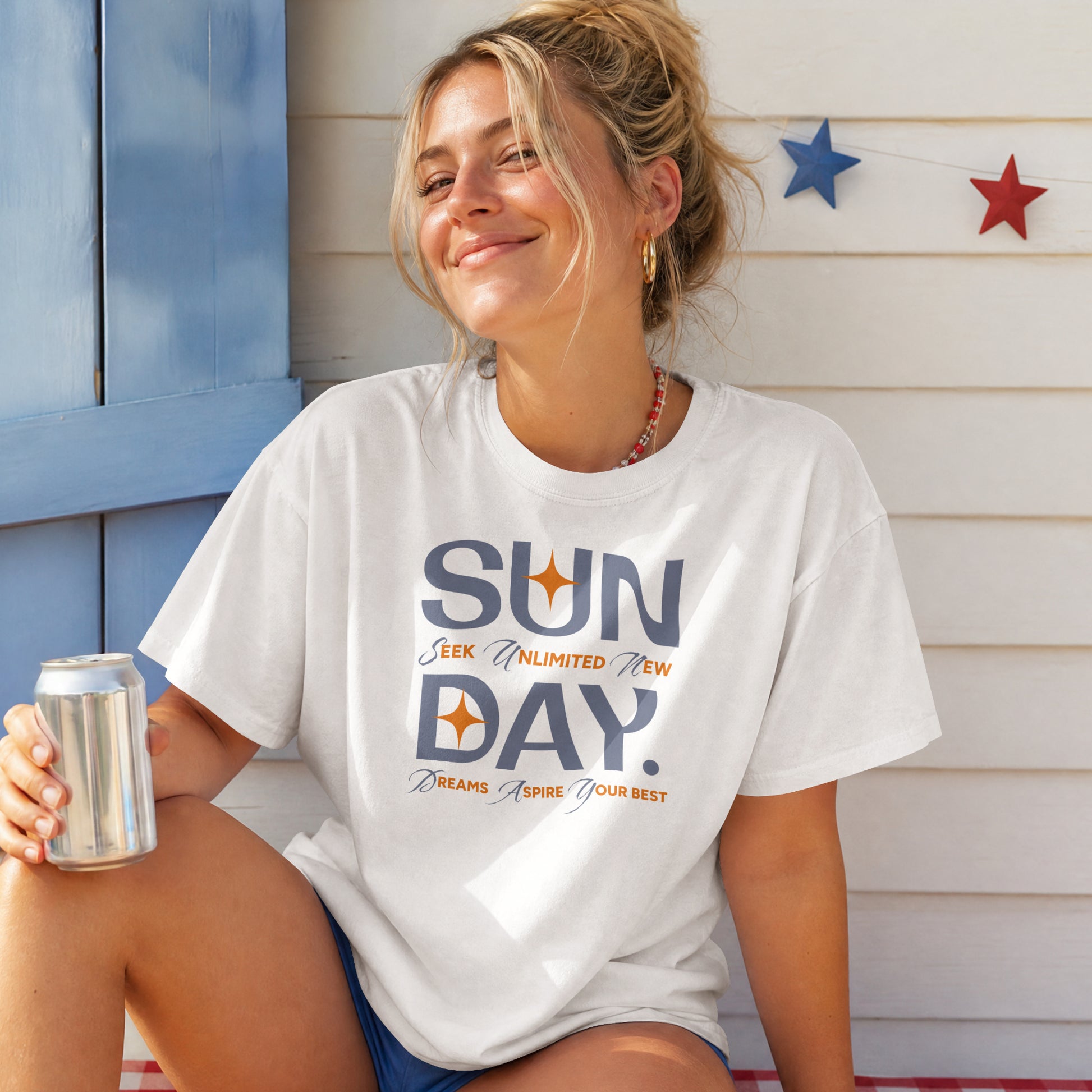 White unisex oversized t-shirt featuring 'Sunday Seek Unlimited New Day' graphic print, front view.