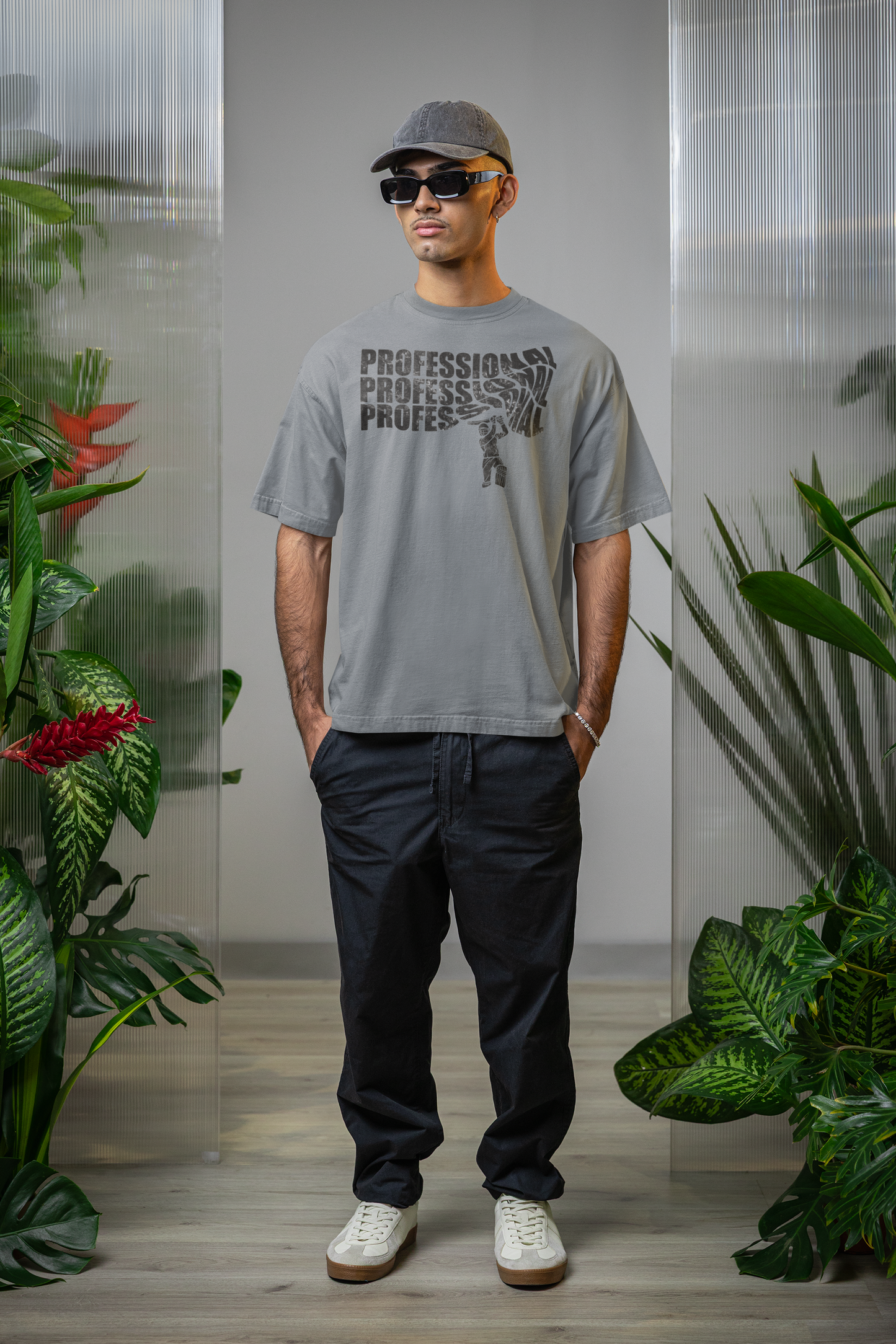 Man wearing a silver frost t-shirt with text professional cricket