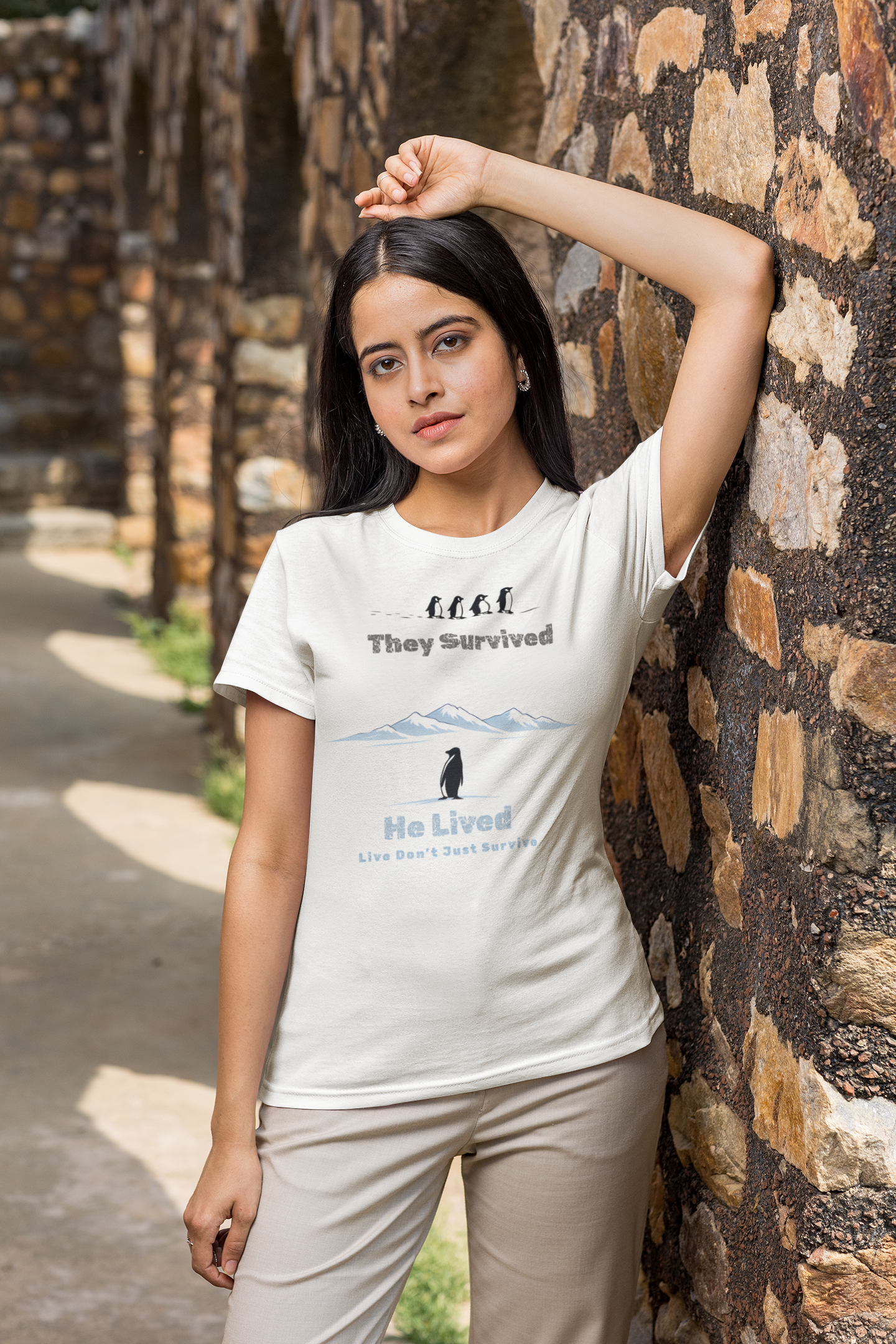 White Minimalist penguin design with inspirational quote “They survived. He lived.” t-shirt style graphic.