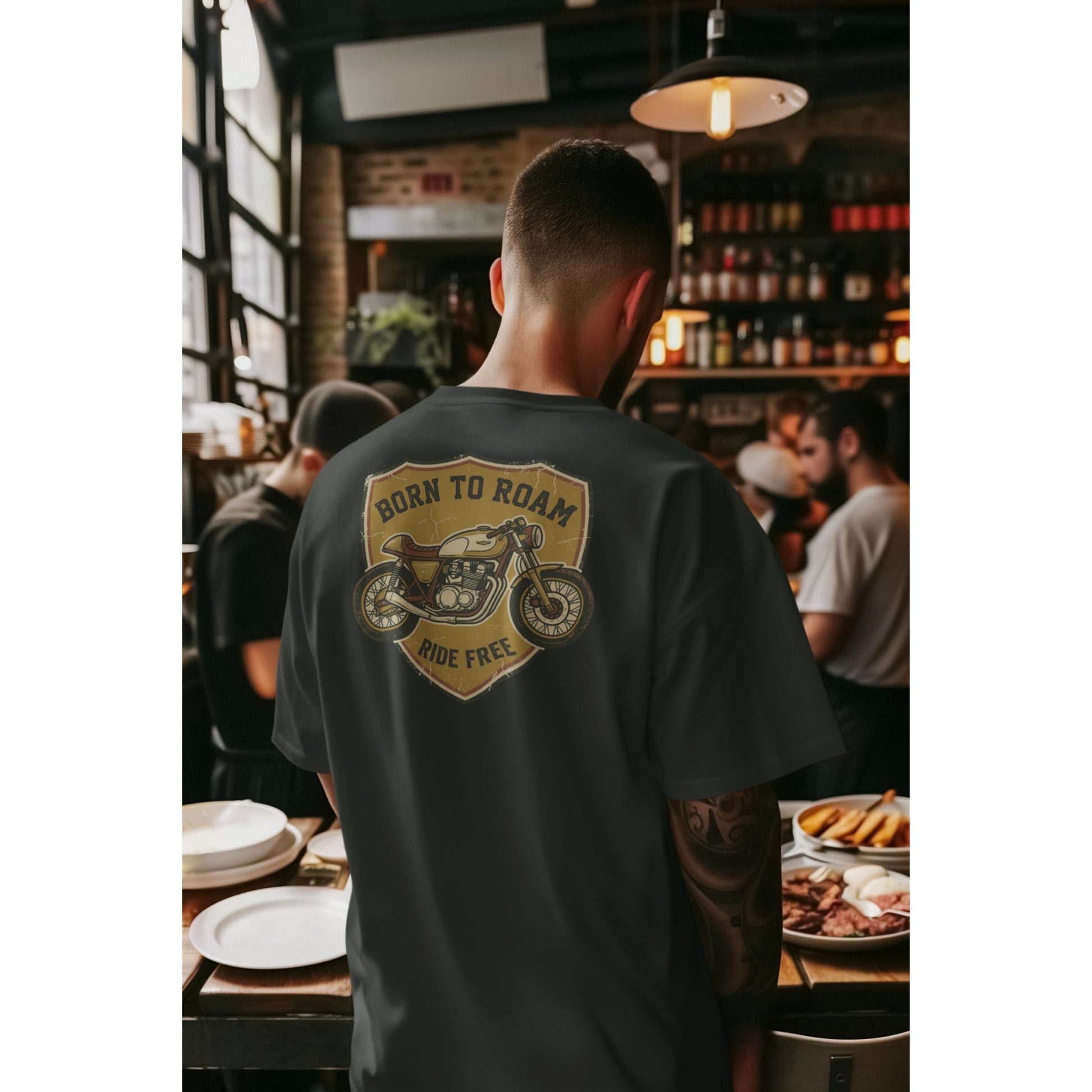 Male model wearing the Nauma Born To Roam cafe racer oversized t-shirt in Black, boxy unisex fit