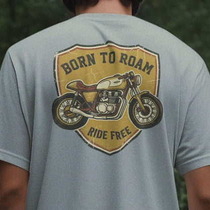 Close-up of the retro motorcycle shield print on a Silver Frost grey oversized t-shirt, showing print detail and scale across the shoulders