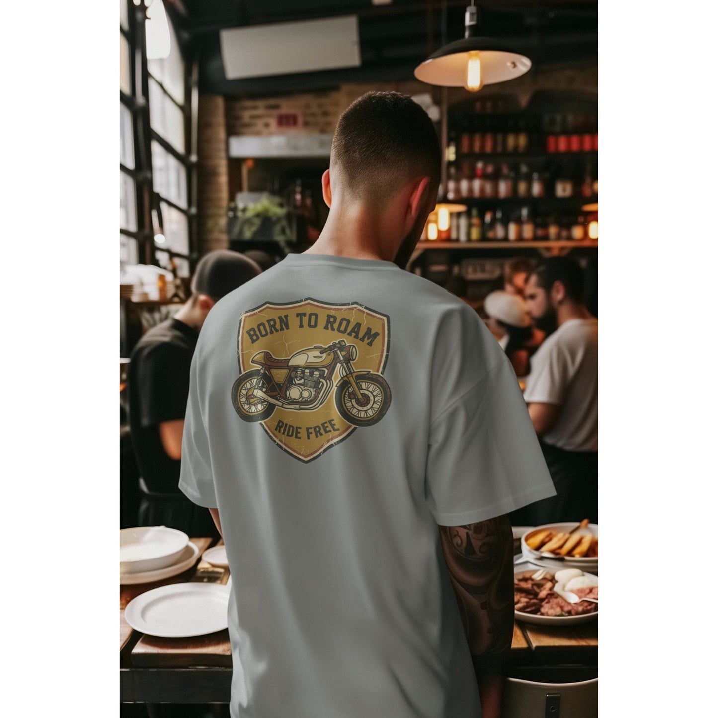 Male model wearing the Nauma Born To Roam cafe racer oversized t-shirt in Silver Frost grey, boxy unisex fit